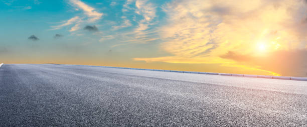 istock Asphalt highway and beautiful clouds landscape at sunset 1164460377