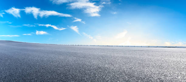 istock Asphalt highway and beautiful clouds landscape at sunset 1164460445
