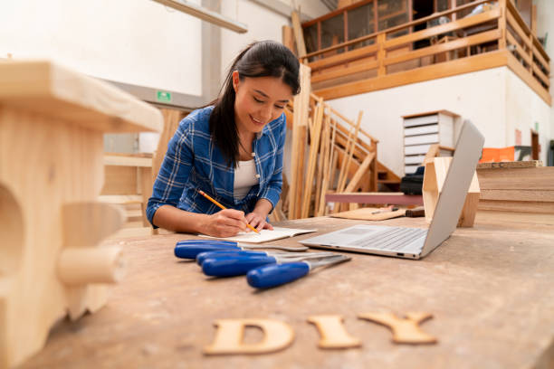 istock Designer building a project at a wood workshop 1164461121