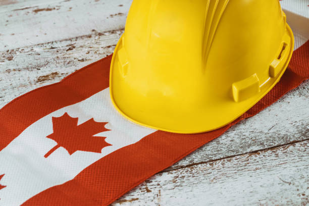 istock Canada happy labor day greeting card and yellow helmet 1164463656