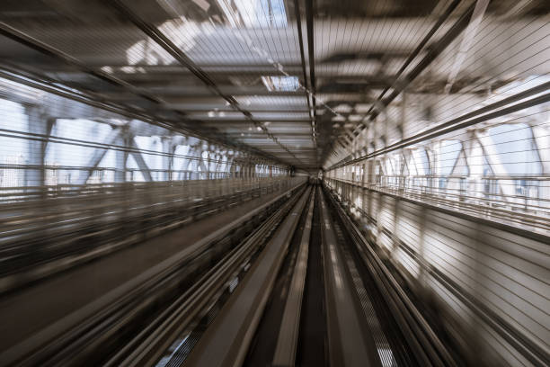 istock motion-blurred view from a moving train running in tunnel 1164464199