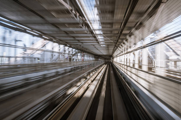 istock motion-blurred view from a moving train running in tunnel 1164464240