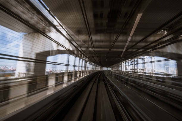 istock motion-blurred view from a moving train running in tunnel 1164464242