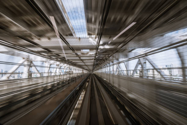 istock motion-blurred view from a moving train running in tunnel 1164464290