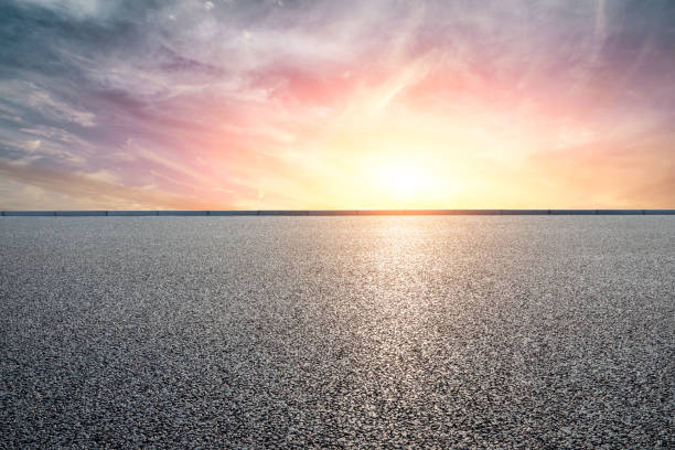 istock Asphalt road and beautiful clouds landscape at sunset 1164465793