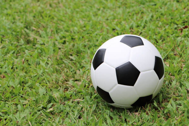 istock closeup football on turf 1164465828