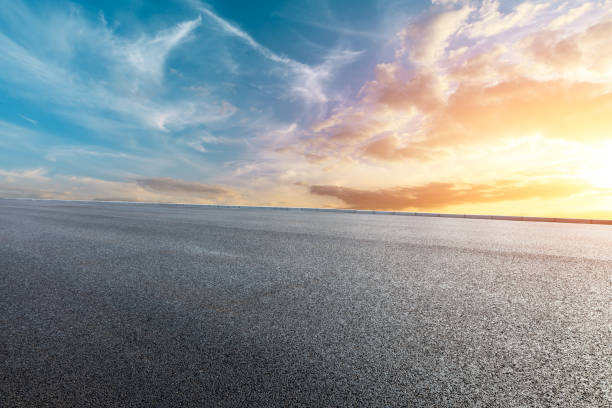 istock Asphalt road and beautiful clouds landscape at sunset 1164465890
