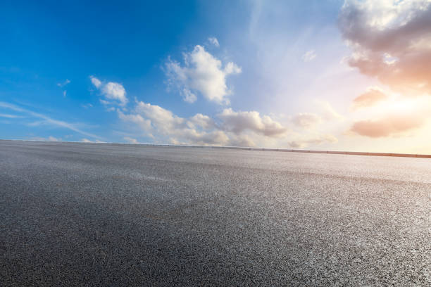 istock Asphalt road and beautiful clouds landscape at sunset 1164465892