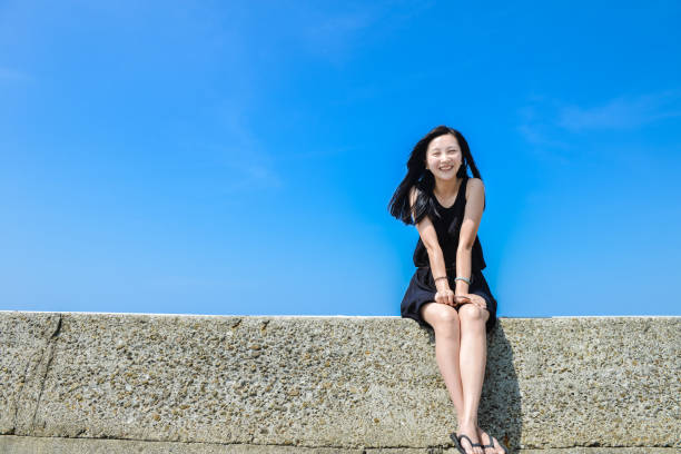 istock Single Asian girl smiles to camera 1164465958