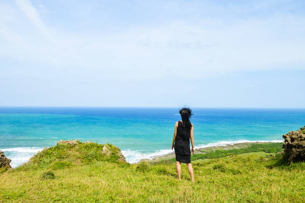 Single Asian girl having fun at Longpan Park, Kenting, Taiwa
