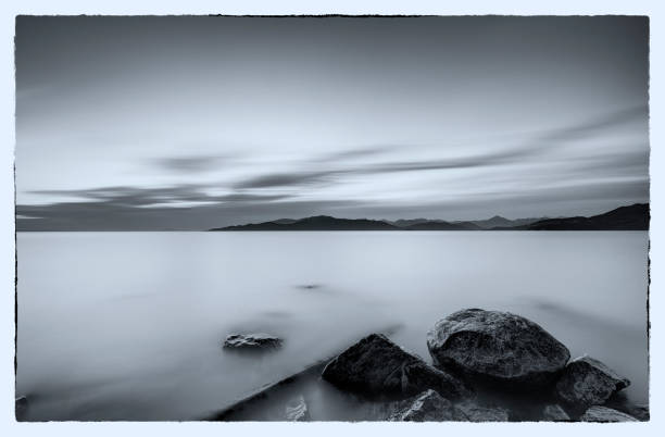 istock black and white image: smooth sunset glow view from Tower Beach, UBC, Vancouver, BC, Canada 1164469003