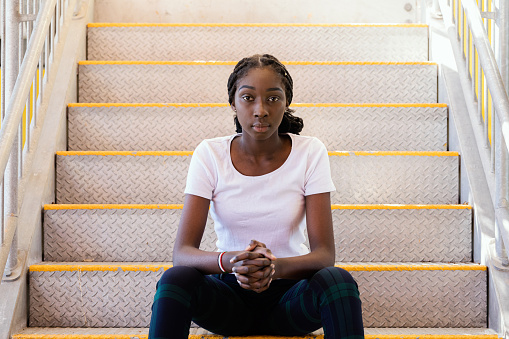 African Australian Teenage Girl In Jeans and White T Shirt