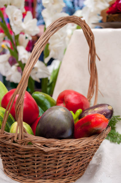 Autumn harvest: basket with vegetables, pepper, aubergines, tomatoes