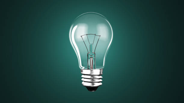 istock Lighting bulb lamp illuminating dark black background, 3D rendering 1164473074