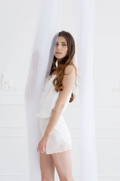 istock Beautiful bride underwear morning in white interior 1164473098