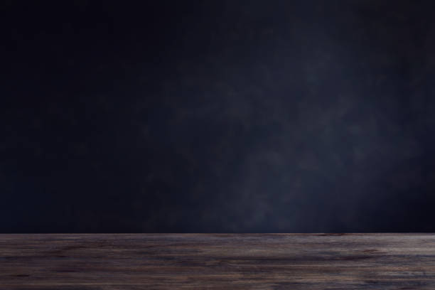 istock background with wooden table and dark wall 1164474312