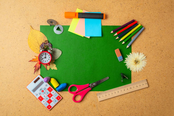 istock Back to school concept. Alarm clock and school supplies. Copy space 1164478809