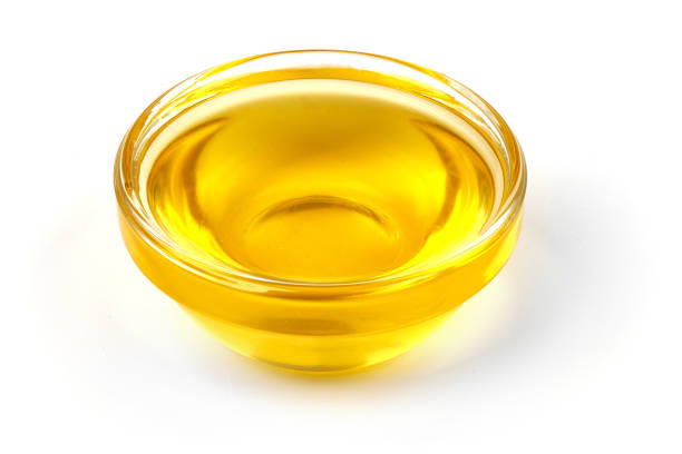 istock Glass with olive oil, isolated on white background. Close-up. 1164482069