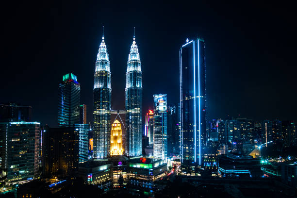 2019 May 10th, Malaysia, Kuala Lumpur - view of the Petronas twin towers and other buildings in the city at night.