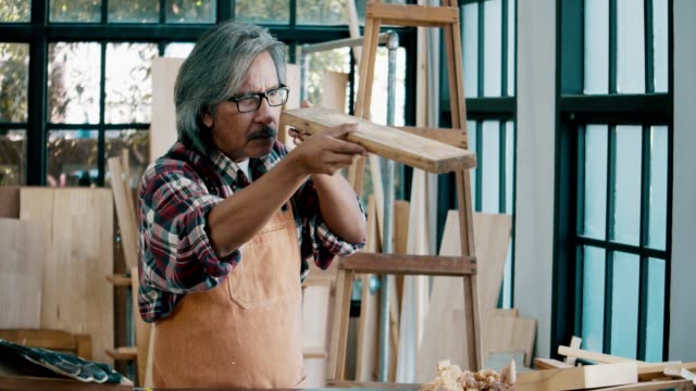 Senior man working with wood