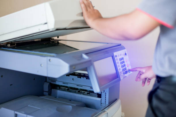 istock Selective focus to men press the button on panel of the copier and scanner. 1164489735