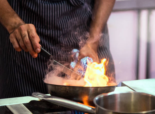 istock Chef preparing food, meal, in the kitchen, chef cooking, Chef decorating dish 1164494152