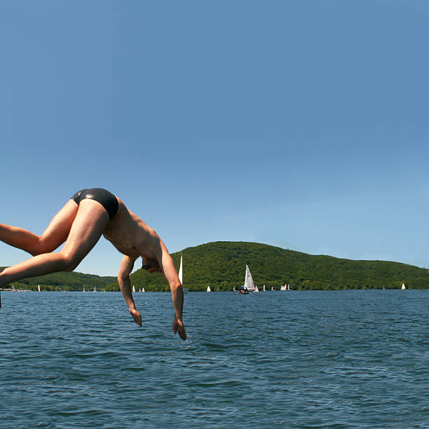 Swimmer jumping to sea water