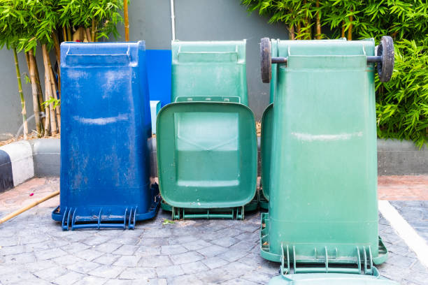 istock Dustbins trashcan rubbish bins outside against brick wall in Thailand 1164494476