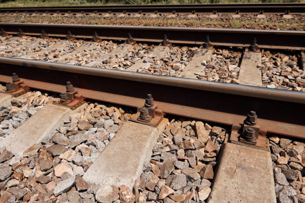 istock railway rails close view - abstract background, freight transportation concept 1164499197