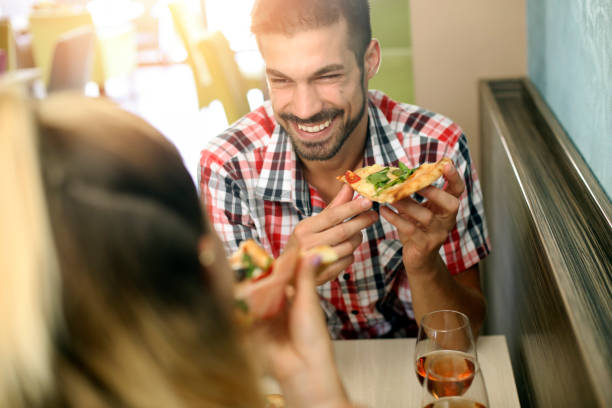 istock Young couple in a pizzeria 1164499205