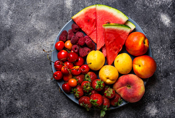 istock Different summer fruits and berries 1164500574