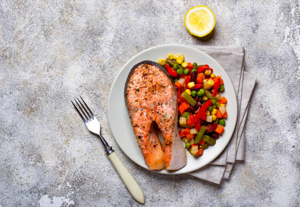 istock Baked salmon fillet with vegetables 1164500577