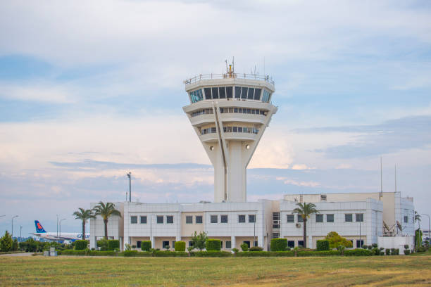 istock Airport tower and building with cloudy skies 1164502535