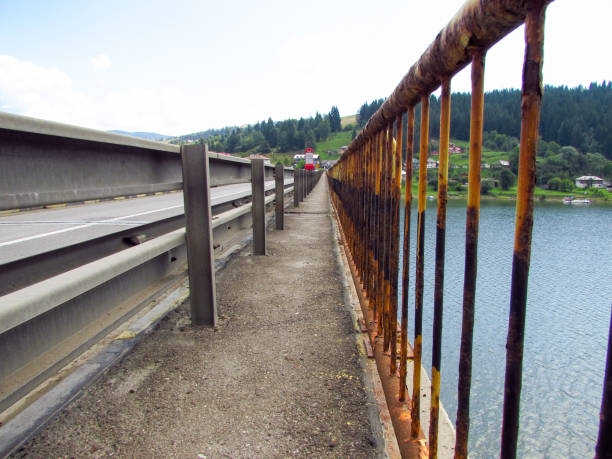istock Bridge over mountain lake, Bicaz, Romania 1164504705