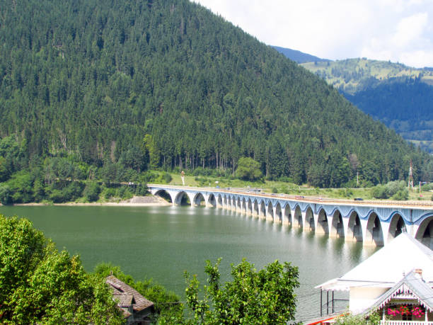 istock Bridge over mountain lake, Bicaz, Romania 1164504743
