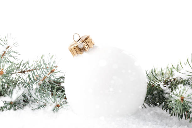Christmas white baubles on the wooden background
