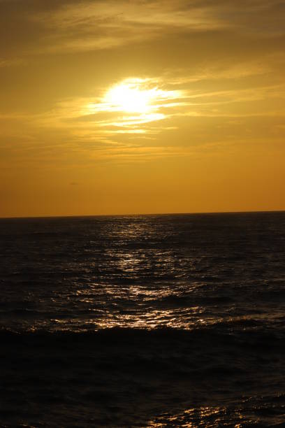 istock Sunset in an orange sky to the beach 1164508627
