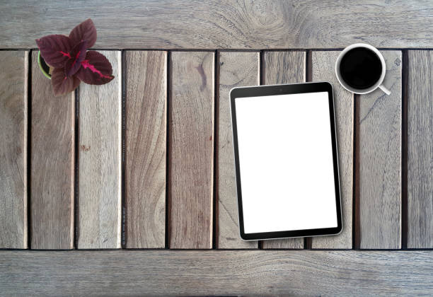 istock Top View of Office Desktop With Blank Screen Tablet PC 1164513452