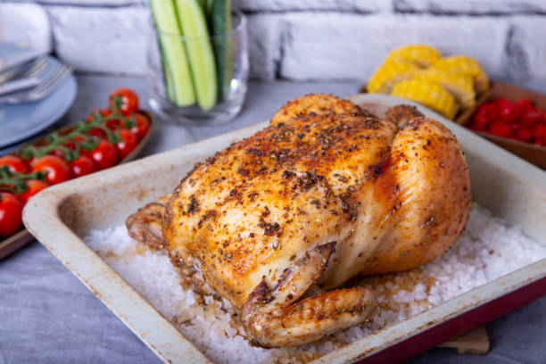 istock Chicken whole baked on salt. With vegetables. 1164514808