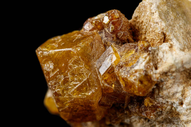 istock Macro stone Grossular mineral on a black background 1164516858