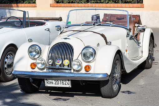 Rome,Italy - July 21, 2019: On occasion of  Rome capital city Rally event, an exhibition of vintage cars has been set up with the beautiful sport white car model Morgan produced by the English car manufacturer Morgan