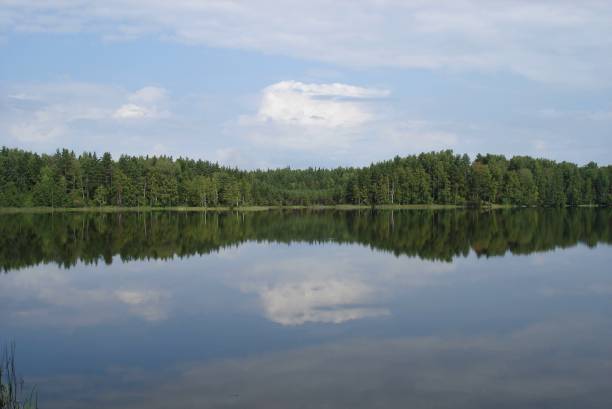 istock Reflection of clouds on the smooth surface of the lake 1164517108