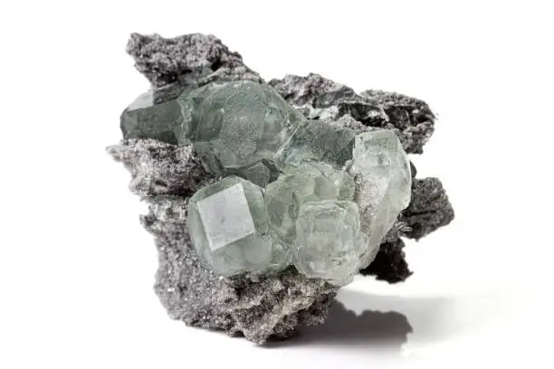 Macro stone Fluorite mineral on white background close up