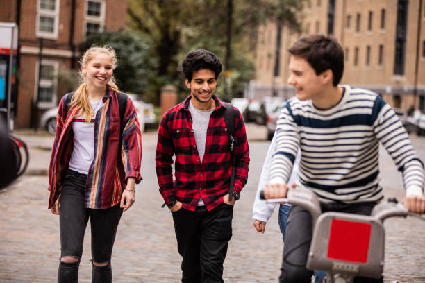 istock Guys walking home after school in London 1164519776
