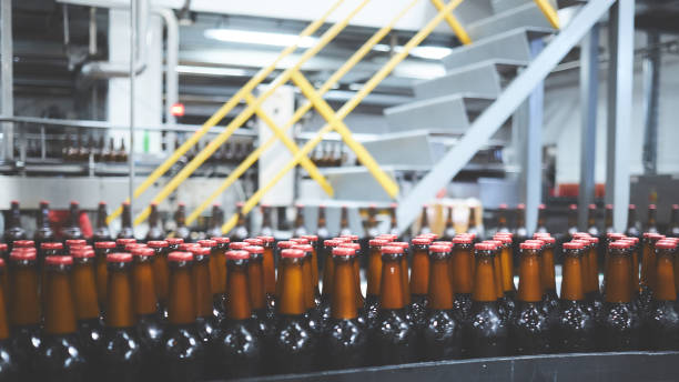 istock Beer bottles on the conveyor belt. Shallow dof. Selective focus. 1164521139