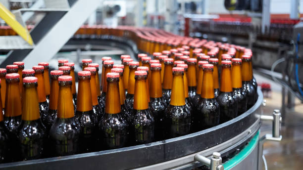 istock Beer bottles on the conveyor belt. Shallow dof. Selective focus. 1164521142