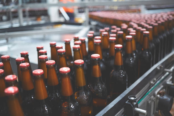 istock Beer bottles on the conveyor belt. Shallow dof. Selective focus. 1164521150