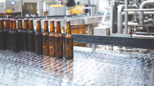 istock Beer bottles on the conveyor belt. Shallow dof. Selective focus. 1164521151