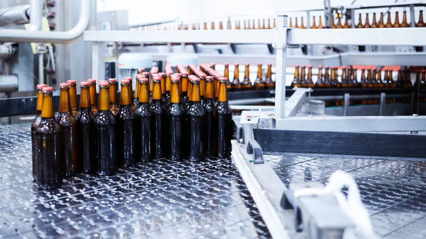 istock Beer bottles on the conveyor belt. Shallow dof. Selective focus. 1164521159