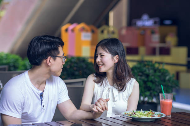 istock Couple at cafe talking during lunch 1164521212